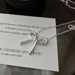 Elegant S925 silver necklace with twisted rope texture bow pendant and classic link chain