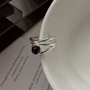 S925 sterling silver multi-layer wrap ring with black agate bead on a porcelain edge