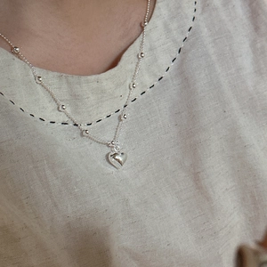 Elegant S925 sterling silver heart pendant necklace on a delicate beaded chain