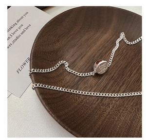Macro shot of S925 sterling silver necklace pendant with Dream come true engraving
