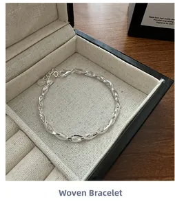 Detail of S925 sterling silver braided chain bracelet in a premium jewelry gift box