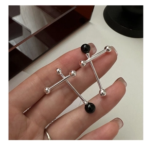 Detailed view of S925 silver geometric barbell earrings featuring black agate accents