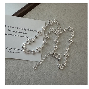 Detailed close-up of S925 sterling silver beaded flower necklace with lobster clasp