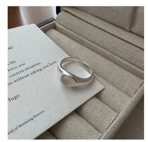 Macro view of matte S925 sterling silver ring with oval moonstone in a gift box