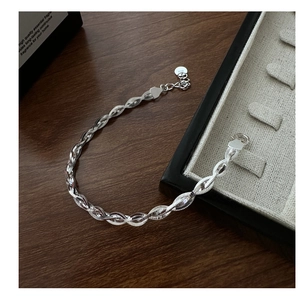 Close-up of S925 sterling silver woven multi-strand chain bracelet with ring clasp detail