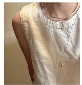 Detail of S925 sterling silver minimalist hollow choker and ball pendant necklace on model