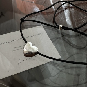 Minimalist S925 silver heart necklace with black adjustable rope cord on a stylish card