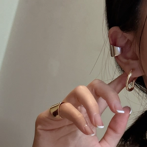Minimalist S925 silver ear cuff and gold irregular twisted hoop earrings on model