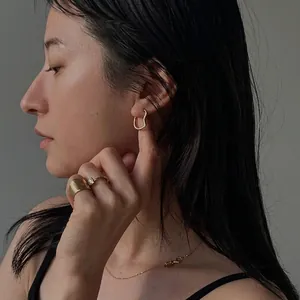 Ena Matsumoto style S925 silver heart hoop earrings and gold rings on female model
