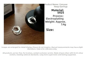 Macro detail of S925 sterling silver concave earrings with matte finish and U-shape design