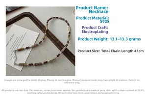 Detail of S925 silver necklace with brown beads on wooden tray and linen cloth