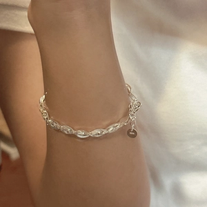 Minimalist S925 sterling silver woven twist chain bracelet worn on a female wrist