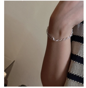 Detailed close-up of S925 silver chain bracelet featuring hollowed out LOVED letter plate