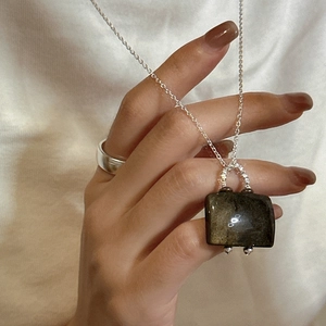 Elegant S925 silver necklace featuring a rectangular natural gemstone pendant on fabric