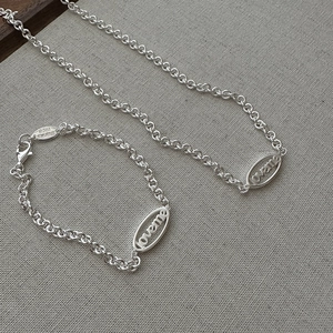 Elegant S925 sterling silver necklace and bracelet set with loveme engraved oval pendants