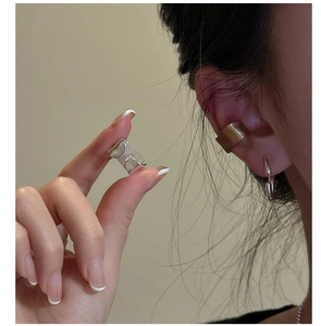 Detailed macro view of S925 sterling silver frosted texture non-pierced ear cuff