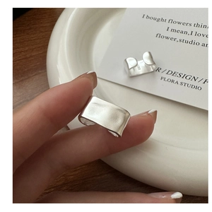 Detail of S925 sterling silver ring featuring a matte brushed texture and engraved hallmark