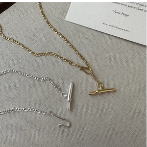 Detail of S925 sterling silver Figaro chain necklace with T-bar toggle closure