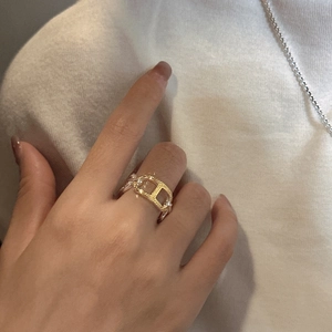 S925 sterling silver ring with gold chain buckle design worn on finger for casual style