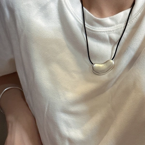 Minimalist S925 sterling silver irregular bean pendant necklace on a black cord