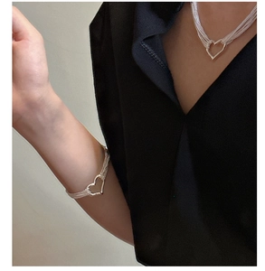 Detail showing elegant S925 sterling silver multilayer heart necklace and bracelet set