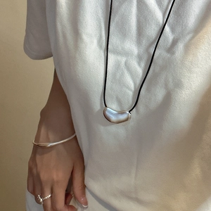 Minimalist S925 silver bean pendant with black cord necklace, sleek bangle and open ring set