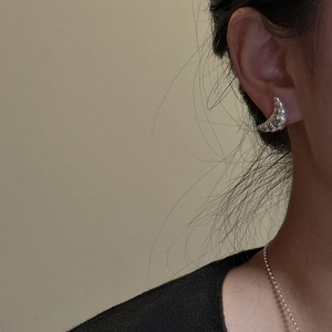 S925 sterling silver croissant stud earrings worn by model for elegant minimalist style