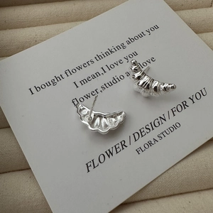 Minimalist S925 sterling silver croissant stud earrings on elegant jewelry card