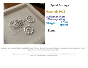 Detail view of S925 sterling silver spiral jewelry set with earrings and ring