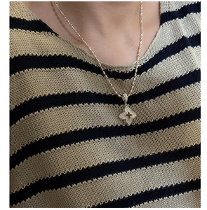 Close-up of S925 sterling silver four-leaf clover pendant necklace with micro-pave crystals