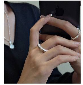 Detailed close-up of S925 sterling silver rings with horizontal wrinkled texture design