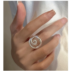 Minimalist S925 sterling silver ring with a unique spiral snail shell design on finger