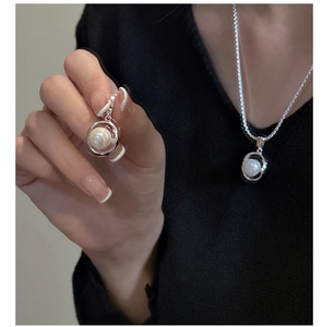 Detail of S925 silver necklace and earrings set featuring minimalist pearl pendants