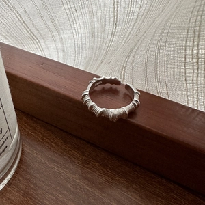 Minimalist S925 sterling silver ring featuring unique pleated textures and an open band design