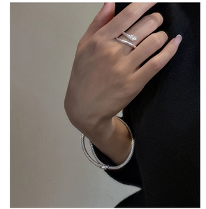 Detailed macro view of S925 sterling silver snake ring with textured scale surface pattern