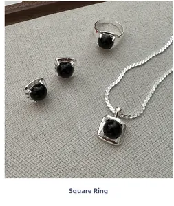 S925 sterling silver jewelry set featuring black onyx necklace, ring, and earrings