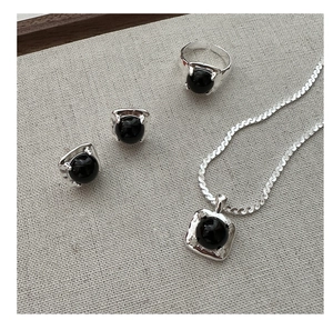 Detail shot of S925 sterling silver jewelry set featuring black onyx inlay stones