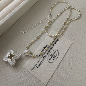 S925 silver four leaf clover pendant necklace with gold accents and floral engraving