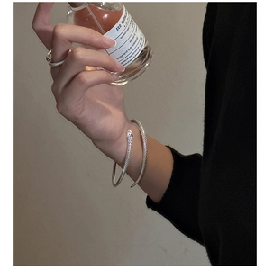 Detailed view of S925 silver snake ring and bracelet with lifelike scale texture