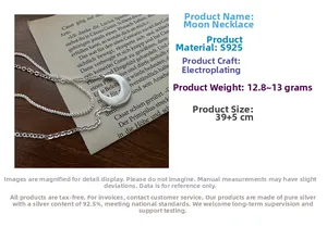 Detailed view of S925 silver moon necklace with layered chains and brushed texture finish