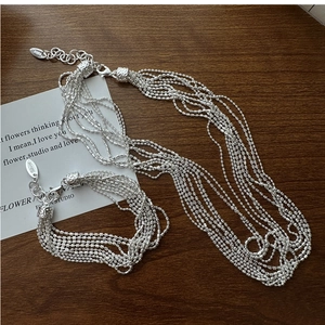 Detail showing S925 sterling silver beads and hallmark on multi-strand jewelry set