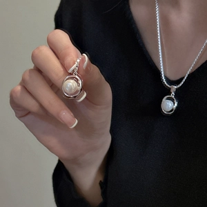 Minimalist S925 sterling silver necklace with hollow round pearl pendant on model