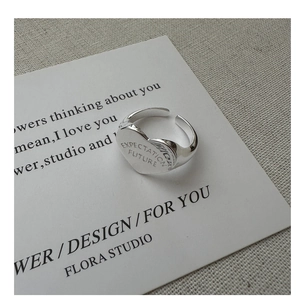 Detailed close-up of S925 sterling silver heart ring with Expectation and Future engraving