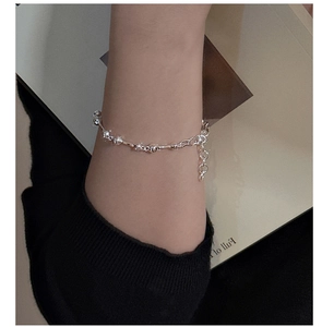 Detail of S925 sterling silver liquid metal style bracelet with irregular lava beads