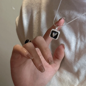 Minimalist S925 silver necklace with black enamel heart pendant and matching ring