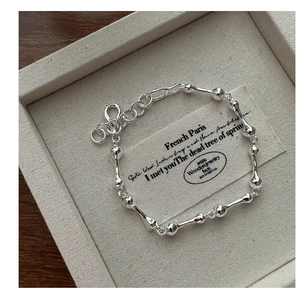 Detailed shot of S925 sterling silver bone chain bracelet with polished mirror finish