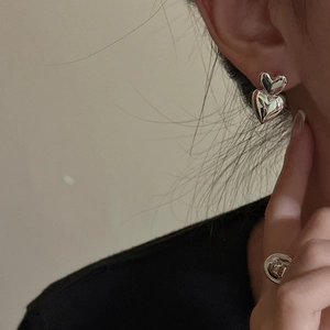 Polished S925 sterling silver double heart earrings and engraved ring on female model