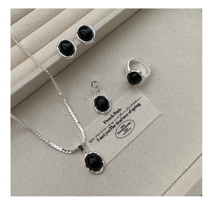 Detailed set of S925 silver black onyx jewelry including ring, necklace and earrings