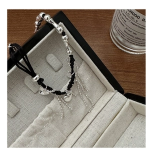 S925 silver beaded bracelet with heart pendants and tassels in a black jewelry box