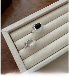 Detailed macro view of matte S925 silver rings with black agate and white gemstone